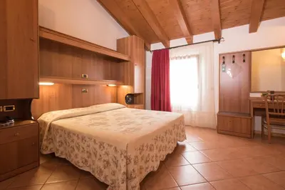 Letto o letti in una camera di Agriturismo Da Merlo
