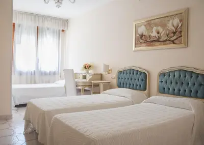 Letto o letti in una camera di Hotel Villa Serena