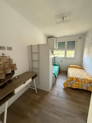 Letto o letti in una camera di Attico Sole a Jesolo con terrazza panoramica