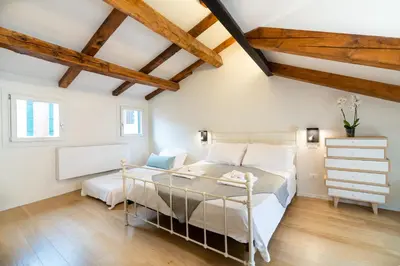 Letto o letti in una camera di Palazzina Schiavoni by Sarlux
