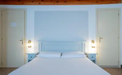 Letto o letti in una camera di Alla Corte Rossa