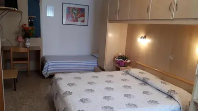 Letto o letti in una camera di Hotel Villa Dina