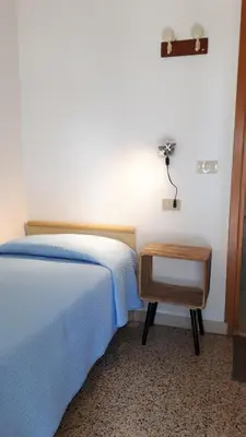 Letto o letti in una camera di Hotel Villa Dina