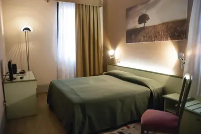 Letto o letti in una camera di Hotel Valbrenta