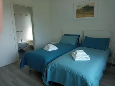 Letto o letti in una camera di Casa Vittoria Guest House