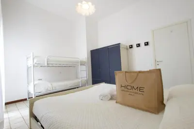 Letto o letti in una camera di Bagni Miramare - Home Immobiliare Jesolo