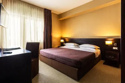 Letto o letti in una camera di Hotel Petit Palais