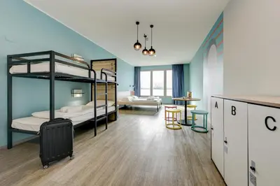 Letto o letti in una camera di MEININGER Venezia Mestre