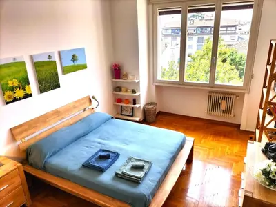 Letto o letti in una camera di DARIO.HOME Amabile dimora in centro a Treviso