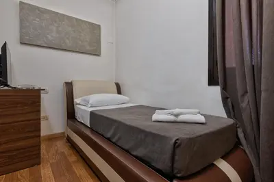 Letto o letti in una camera di Hotel Trieste