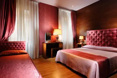 Letto o letti in una camera di Hotel Abbazia