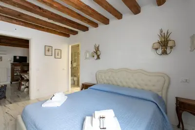 Letto o letti in una camera di Appartamento S. Maurizio - Venezia