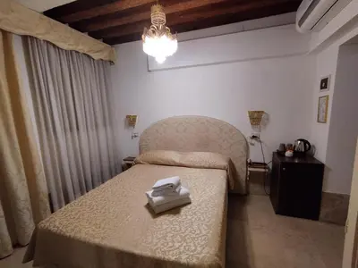 Letto o letti in una camera di Alloggi Acquavita - checkin at 