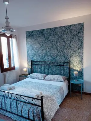 Letto o letti in una camera di Two Steps from Rialto