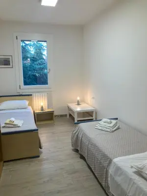 Letto o letti in una camera di ALLA CASA DEI NONNI