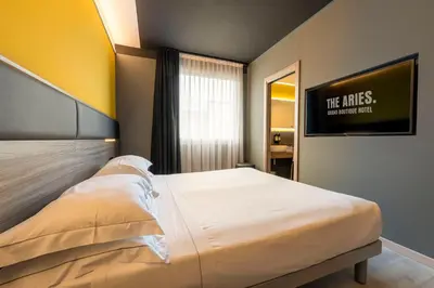 Letto o letti in una camera di The Aries Hotel