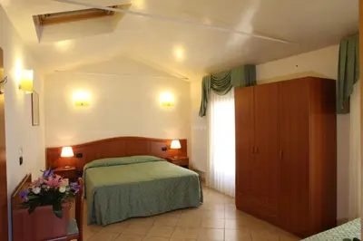 Letto o letti in una camera di Albergo Alla Campana