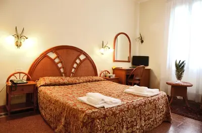 Letto o letti in una camera di Hotel Villa Orio & Beatrice