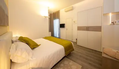 Letto o letti in una camera di Hotel Aurora