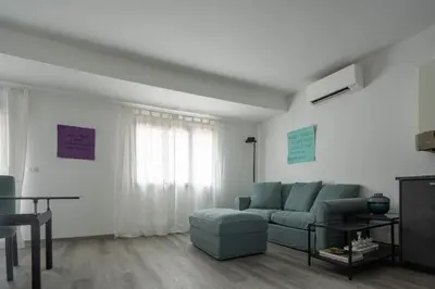 Area soggiorno di Bright Apartment On Venetian Roofs R&R