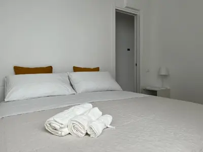 Letto o letti in una camera di Ca' Yvonne alloggio a Lido di Venezia
