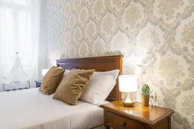 Letto o letti in una camera di Residenza Centopietre - Dorsoduro by Wonderful Italy