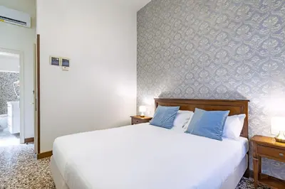 Letto o letti in una camera di Residenza Centopietre - Dorsoduro by Wonderful Italy