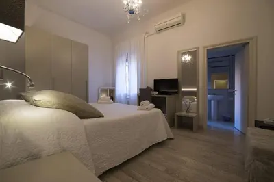 Letto o letti in una camera di Al Portico Guest House