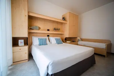 Letto o letti in una camera di Hotel Niagara