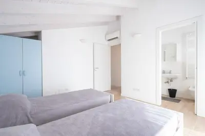 Letto o letti in una camera di Finisterrae 8 - Immobiliare Living