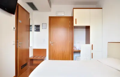 Letto o letti in una camera di Hotel Mezzaluna