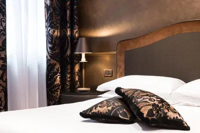 Letto o letti in una camera di Hotel Campiello