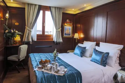 Letto o letti in una camera di Hotel Bucintoro