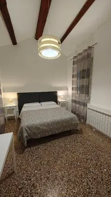 Letto o letti in una camera di Corte Loredana
