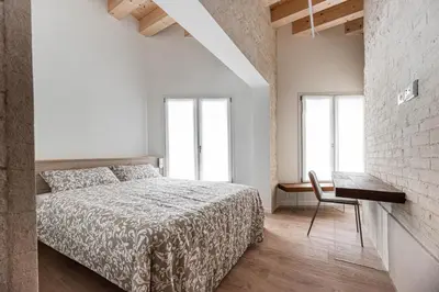 Letto o letti in una camera di Palazzo '900 Exclusive Flats - Il Cattedratico