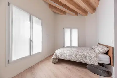 Letto o letti in una camera di Palazzo '900 Design Flats - L'Orologiaio