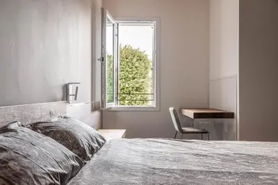 Letto o letti in una camera di Palazzo '900 Design Flats - Il Pittore