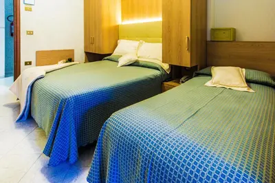 Letto o letti in una camera di Hotel Baviera