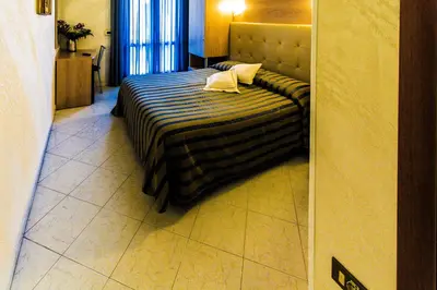 Letto o letti in una camera di Hotel Baviera