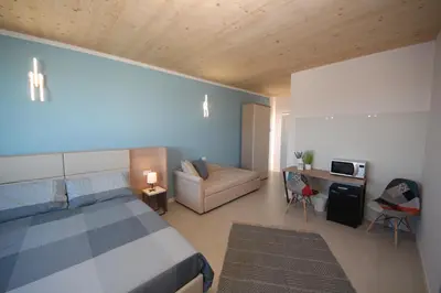 Letto o letti in una camera di Ohana Holiday Rooms