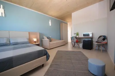 Letto o letti in una camera di Ohana Holiday Rooms