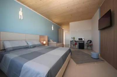 Letto o letti in una camera di Ohana Holiday Rooms