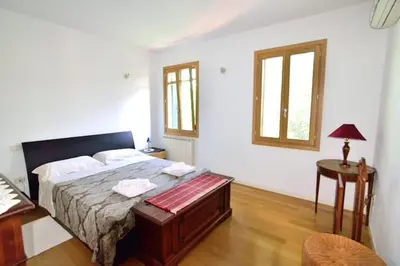 Letto o letti in una camera di Savorgnan Tricamere con terrazza