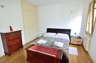 Letto o letti in una camera di Savorgnan Tricamere con terrazza