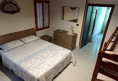 Letto o letti in una camera di Pellestrina Vacanze
