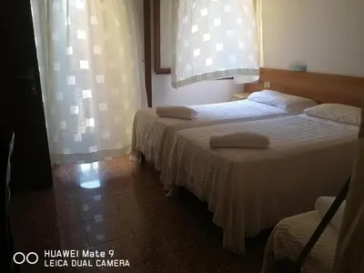Letto o letti in una camera di Alloggi Gerotto Calderan 2