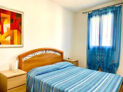 Letto o letti in una camera di HOME - Alessandra Holiday House