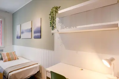 Area soggiorno di GuestHost - Essential Apartment a 5 min da Piazza dei Signori