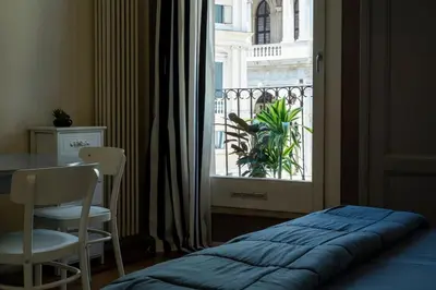 Letto o letti in una camera di iHOMES-Luxury Junior Suite vista Basilica Palladio