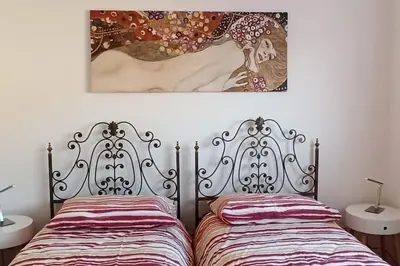 Letto o letti in una camera di Casa vacanze Donna Michela